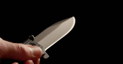 4K - Folding knife in hand. macro Stock Footage 58596378