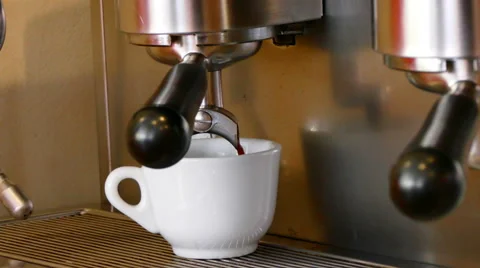 4K footage of, close up coffee machine pouring espresso in white cup Video stock 65506062