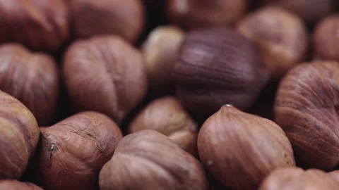 4K Footage. Close up rotating background of hazelnuts Stock Footage 140577771