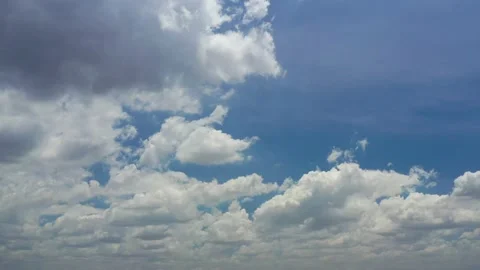 4K footage of cumulus white clouds slowly floating on blue sky Stock Footage 151161445