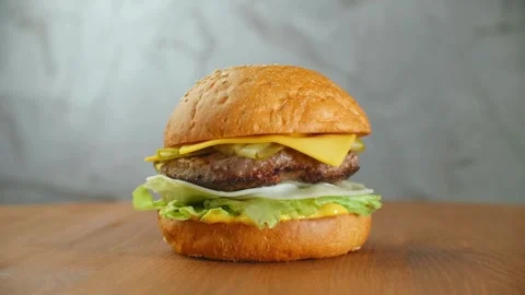4k footage Delicious Beefburger sauce and topped sesame seeds. cooking. Big Video stock 336579306