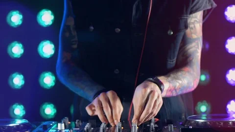 4K footage of a dj hand pulling up the knobs, audio console. Nightlife concept 스톡 동영상 74603354