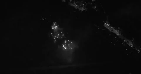4K footage of fireworks exploding in the night sky during a festive celebration Stock Footage 322907279