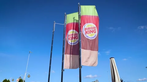 4k footage of flags in front of Burger King restaurant in Witramowo, Poland Stock Footage 141193854