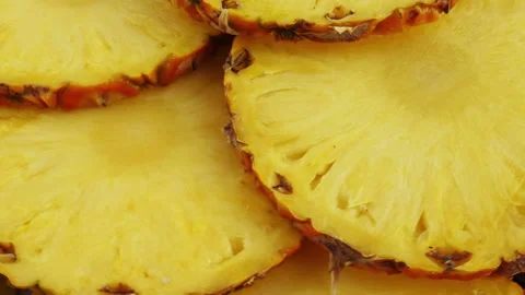 4K Footage. Fresh slice pineapple rotate on plate Stock Footage 140578501