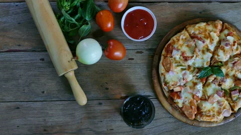 4K footage of hand keeping slice of pizza,melted cheese dripping. View top Video stock 66610609
