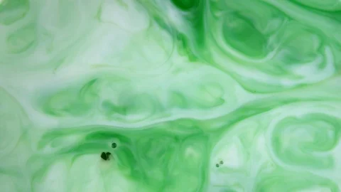 4K footage. Ink in water. Green ink reacting in water creating abstract Stock Footage 119946853