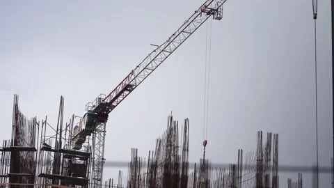 4k footage of a large construction site with several busy cranes at disk, with Stock Footage 193533982