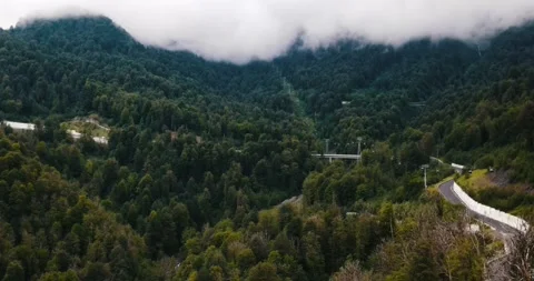 4K Footage of a Mountain Road Through Foggy Peaks Stock Footage 341349846