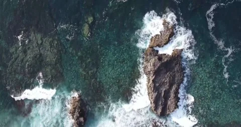 4K Footage of Powerful Ocean Waves Crashing on Rugged Rocky Shoreline Stock Footage 333932239
