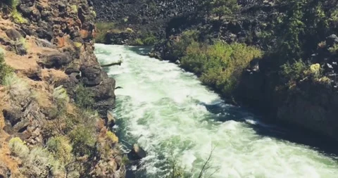 4K footage of Powerful River Rapids Flowing Over Rocky Terrain Stock Footage 346483844