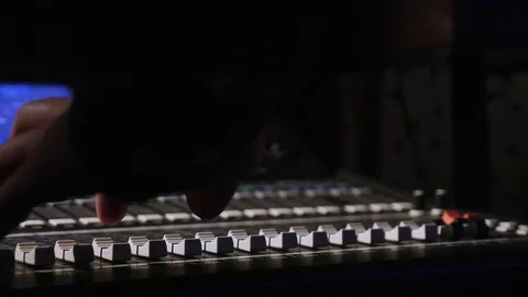 4K footage of a recording studios audio console and a hand pulling up the knobs 스톡 동영상 74666256