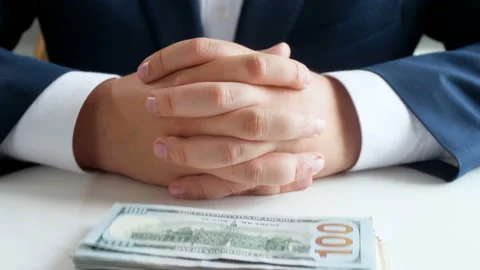 4k footage of stack of US dollars falling on table. Young businessman folding Video stock 94724140