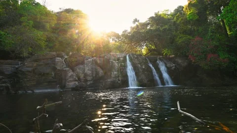 4K footage of sunset passing through beautiful dreamy Kote Abbe Falls Stock Footage