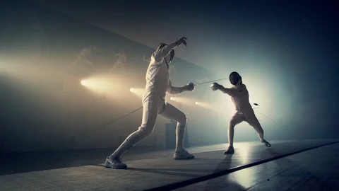 4K Footage of two fencing athletes battle . Professional Fencers competition . Stock Footage