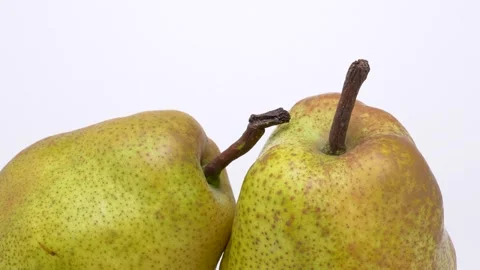 4K footage of two slowly rotating pears. Stock Footage 279628799