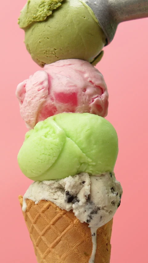 4K footage vertical vibrant stack of four colorful ice cream scoops. Stock Footage 318953239