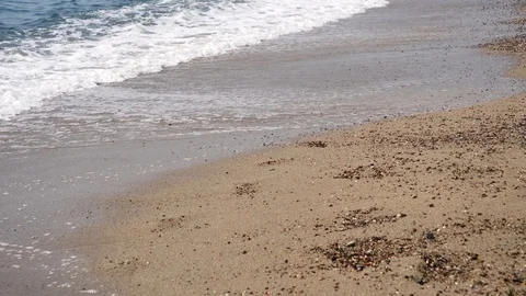 4k Footage of a waves breaking against a beautiful sand beach Stock Footage 112263249