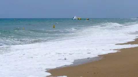4k Footage of a waves breaking against a beautiful sand beach Stock Footage 112263290