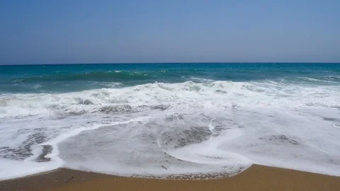 4k Footage of a waves breaking against a beautiful sand beach Stock Footage 112263302
