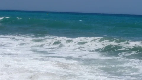 4k Footage of a waves breaking against a beautiful sand beach Stock Footage 112263308