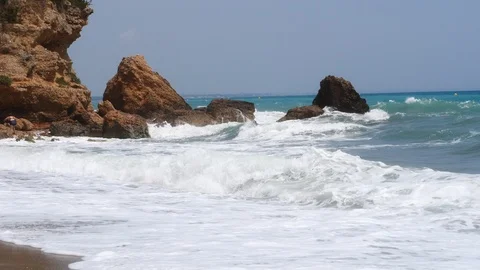 4k footage of a waves breaking against a beautiful sand beach Stock Footage 112263311