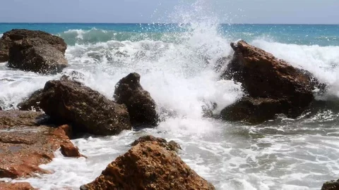 4K footage of a waves breaking against a beautiful Stock Footage 112263314