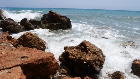 4K footage of a waves breaking against a beautiful white sand beach in the Spain Stock Footage 112263337