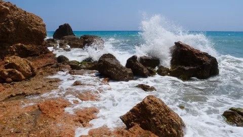 4K footage of a waves breaking against a beautiful Stock Footage 112263342