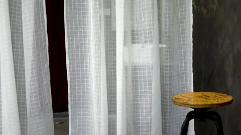 4K Footage ,wind blows through the curtain  open door in the room. Waving white  Stock Footage 159179166