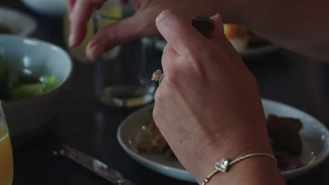 4K footage of women sharing a Caesar salad at an elegant brunch restaurant Stock Footage 332098519