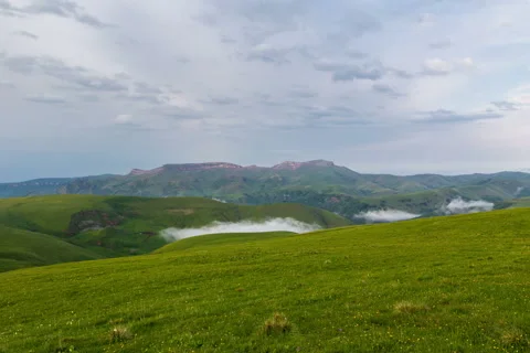 4k. The formation of clouds over alpine meadows. Stock Footage 51432540