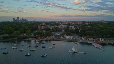 4K Forward Ascending Aerial View of Minneapolis Sailing Center At Sunset Stock Footage 220469520