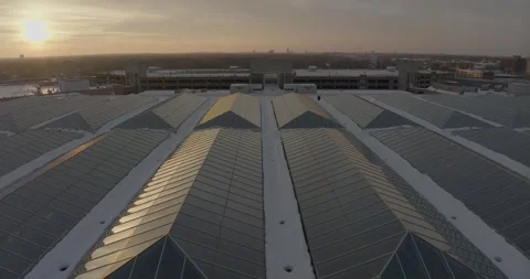 4K Forward Drone Shot Facing Sunset Over Skylights Atop Mall Of America Stock Footage 257417243