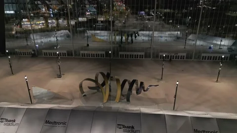 4K Forward Drone Shot Of The Horn Sculpture At Vikings Football Stadium At Night Stock Footage 225648929