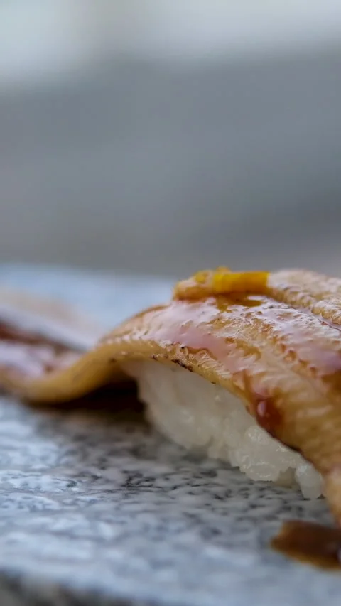 4K fottage. Place the conger eel nigiri sushi on the counter. Stock Footage 313741808