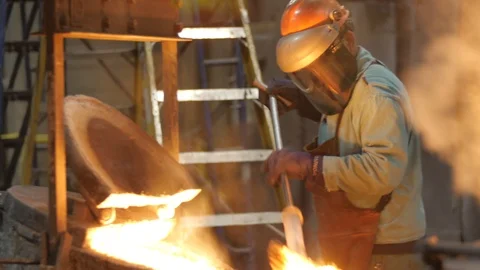 4K Foundry Worker Closing Lid on Iron Foundry Cauldron Stock Footage 98262059
