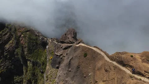 4k FPV drone shot along famous Pico do Arieiro hiking trail and over mountain Stock Footage 320732540