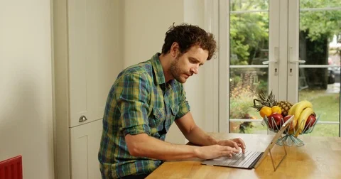 4K Freelance man working at home, trying to solve a problem on computer Stockbeeldmateriaal 80460840