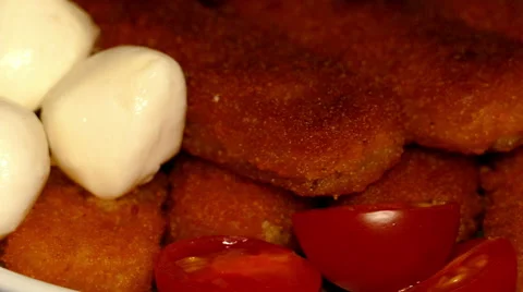 4k – Fried fish sticks with cherry tomatoes and mozzarella balls on plate 03 Stock Footage 56163340