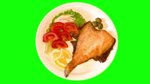 4k fried plaice with fresh vegetables on plate Stock Footage 49665801