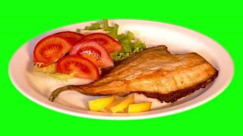 4k fried plaice with fresh vegetables on plate Stock Footage 49756483