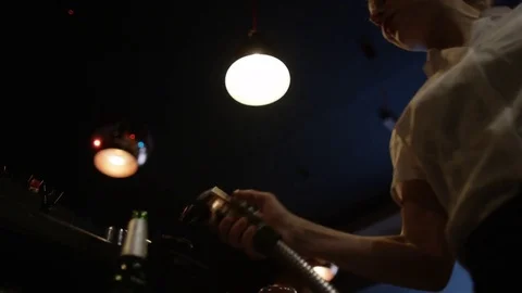 4K Friendly Bar Staff Serving Drinks &amp; Enjoying The Atmosphere In Lively Club Stock Footage 75656596