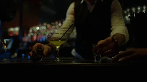 4K Friendly Barman Serving Shots To Female Friends In Nightclub Stock Footage 75655031