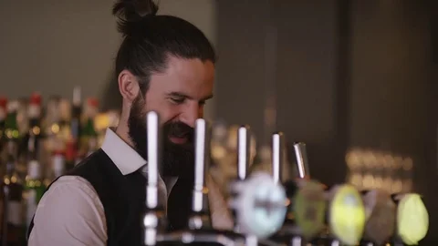 4K Friendly Bartender Serving &amp; Chatting With Customers In City Bar Stock Footage 75753557
