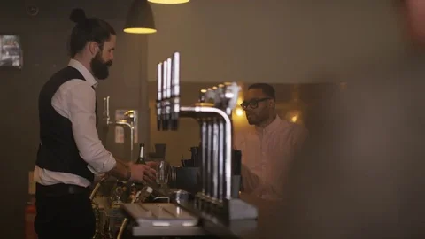 4K Friendly Bartender Serving &amp; Chatting With Customer In City Bar Stock Footage 75761453