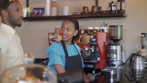 4K Friendly coffee shop workers cheering standing behind the counter. Stock Footage 111340158