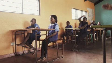 4k Front view of African pupils / students raising hand in class to answer teach Stock-Footage 199625665