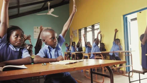 4k Front view of African pupils / students raising hand in class to answer teach Видео 199625798