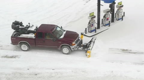 4K full size pickup plowing snow at gas station Stock Footage 47009909